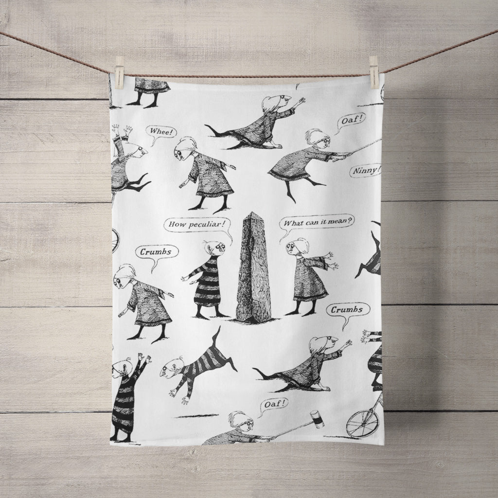 Edward Gorey illustrated tea towel with whimsical characters, speech bubbles, and a monolith