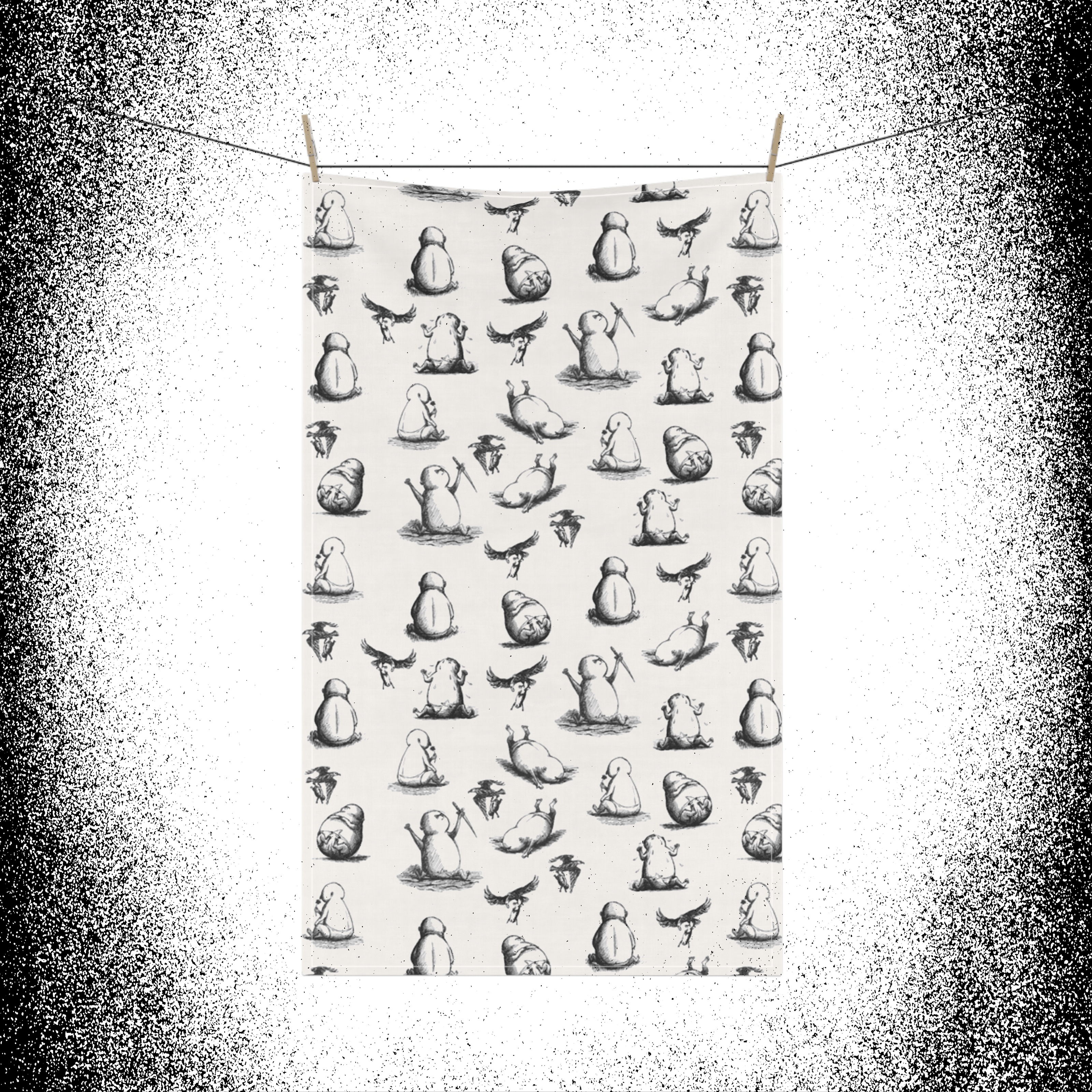 Edward Gorey Beastly Baby tea towel with whimsical black and white creature illustrations hung on a line