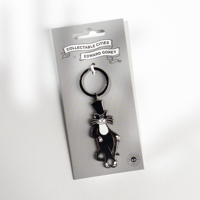 Edward Gorey Bustopher Jones cat keychain on branded card from The Edward Gorey Online Shop