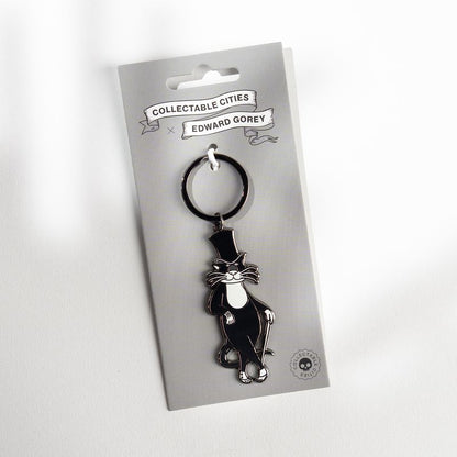 Edward Gorey Bustopher Jones cat keychain on branded card from The Edward Gorey Online Shop