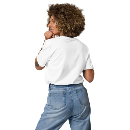 Woman wearing white Edward Gorey Dracula Bat T-shirt and blue jeans, back view