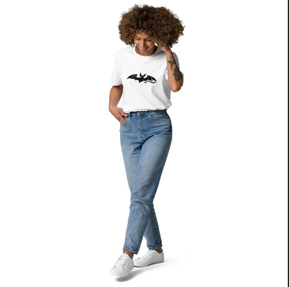 Woman wearing Edward Gorey Dracula Bat T-shirt and jeans, standing against white background