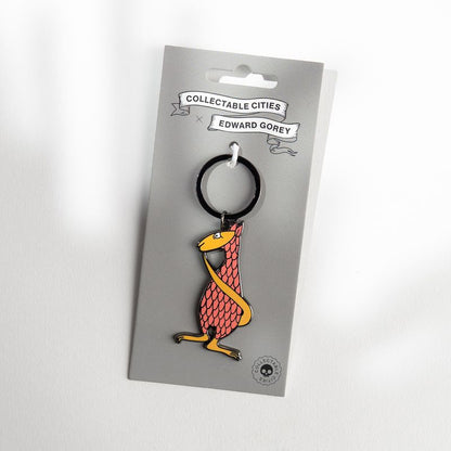 Edward Gorey Fantod keychain with red and yellow creature on branded backing card