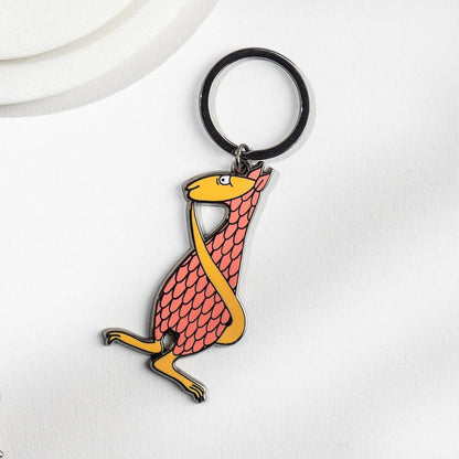 Fantod creature keychain with orange and red scales from The Edward Gorey Online Shop