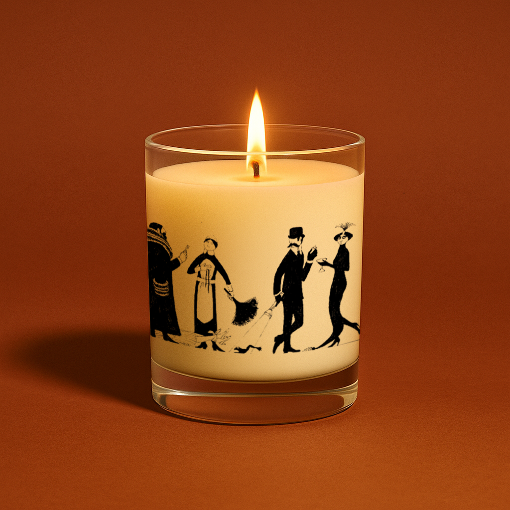 Edward Gorey illustrated glass candle with whimsical black figures, lit on brown background