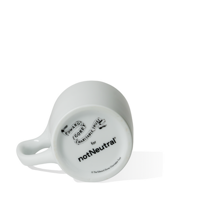 Edward Gorey Catastrophe Mug bottom view with notNeutral branding, white ceramic cup