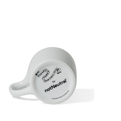 Edward Gorey logo and notNeutral branding on bottom of white ceramic mug
