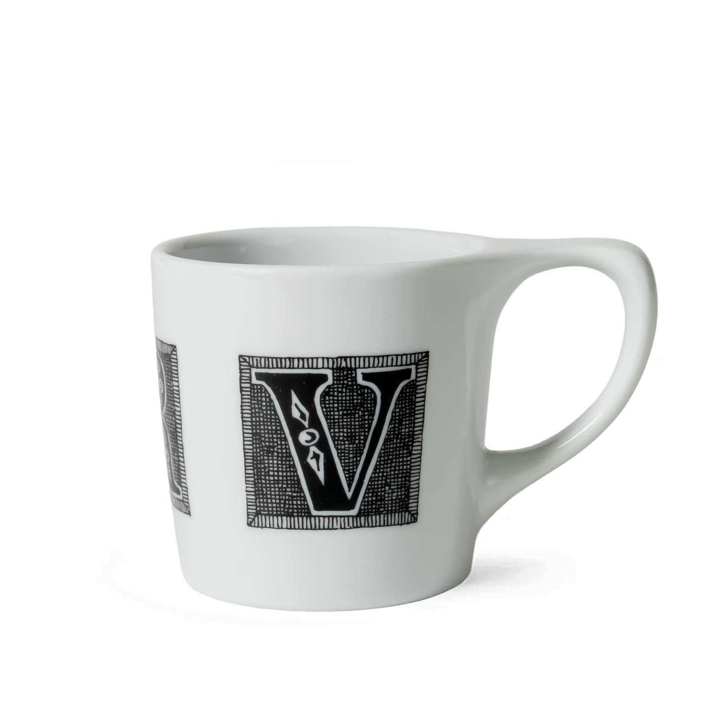 White ceramic mug with Edward Gorey style black letter V illustration, product from The Edward Gorey Online Shop